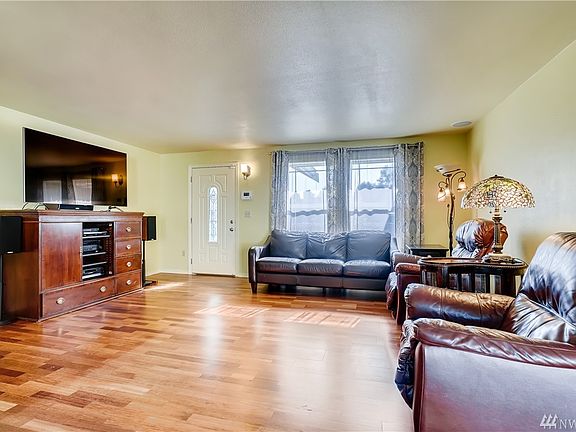 Bright and airy inviting open living space welcomes you to gleaming rich Brazilian cherry hardwood flooring.
