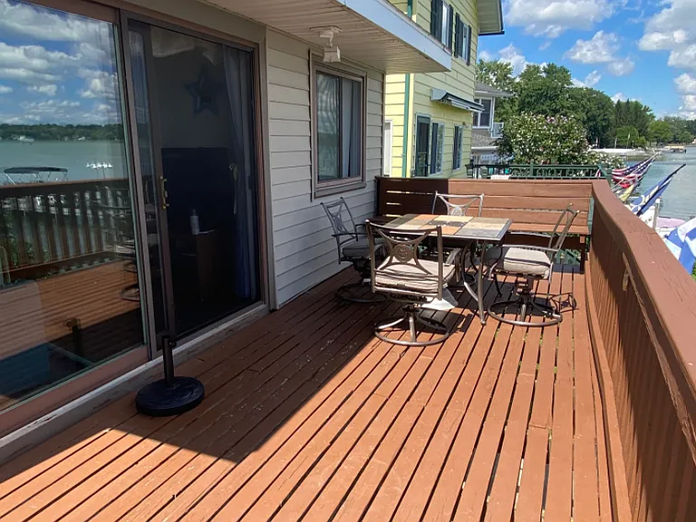 Access the deck from the 9' sliding glass doors from the interior of the home