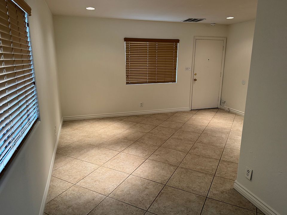 canned lighting through out and designer wood window shades throughout