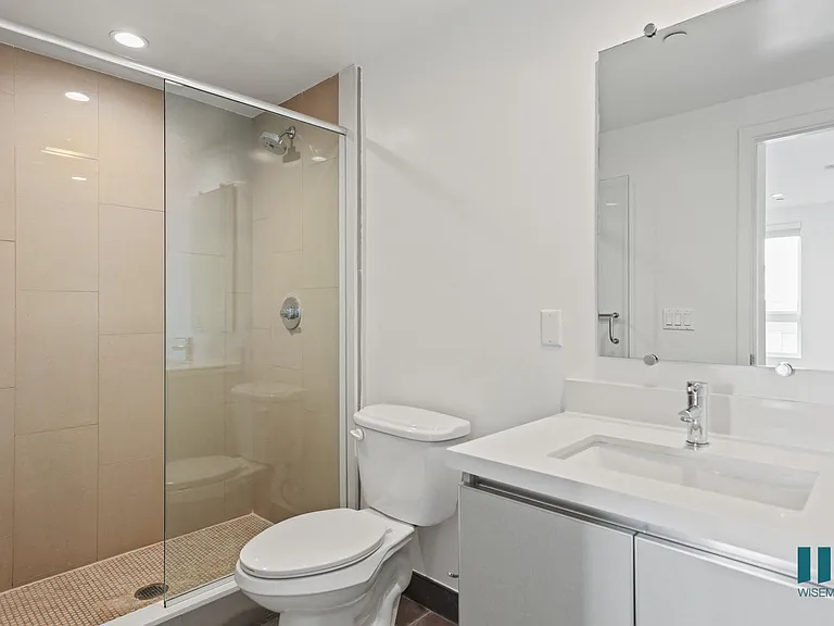 Bathroom with Walk-In Shower and Vanity Cabinet Storage