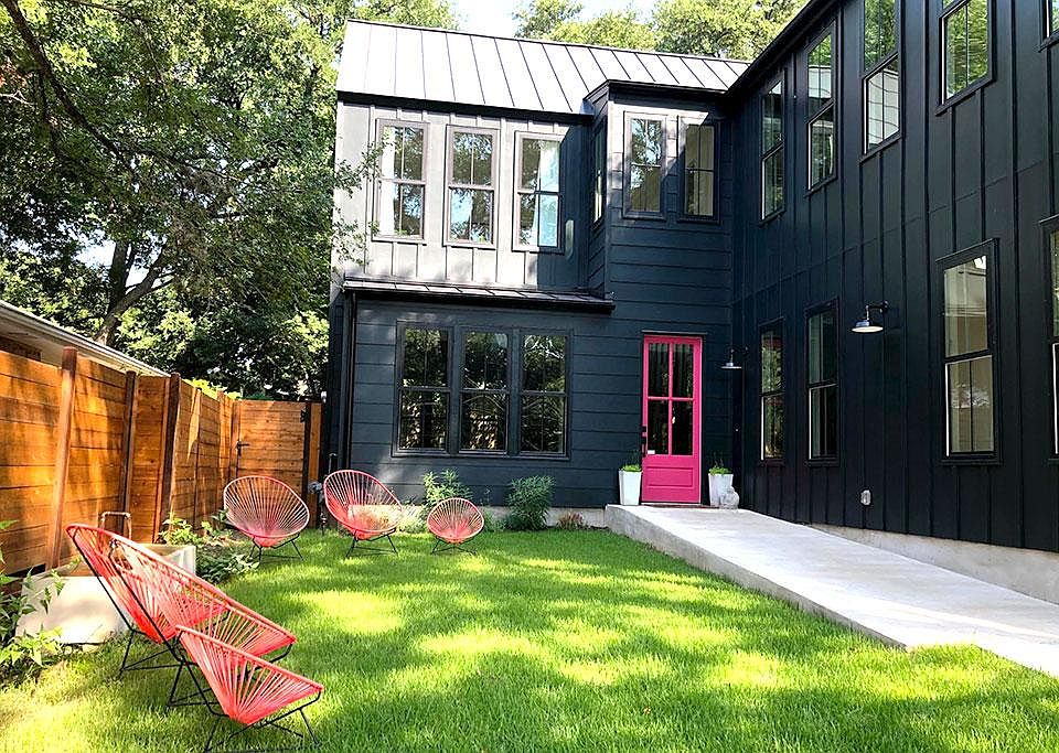 You can call the iconic Tarrytown black farmhouse with the pink door home!