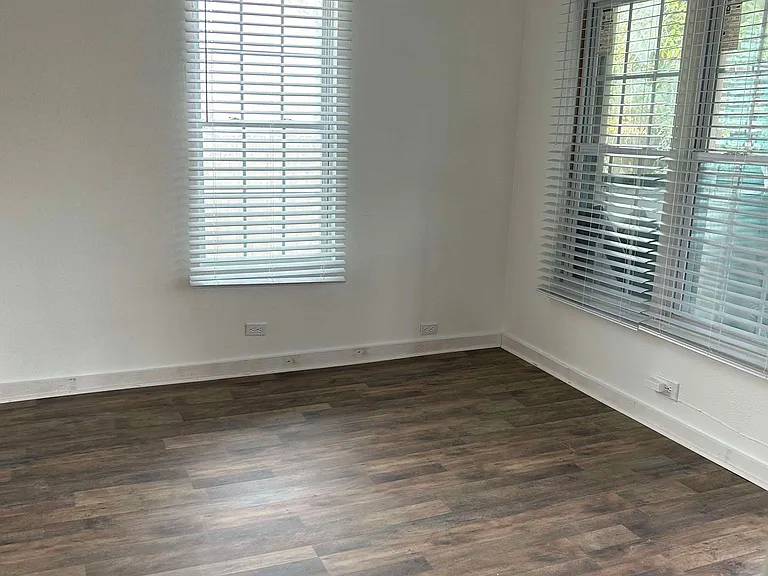 Cozy living area viewed from 1st bedroom