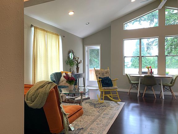 Living room leading to the second-story patio overlooking the front garden