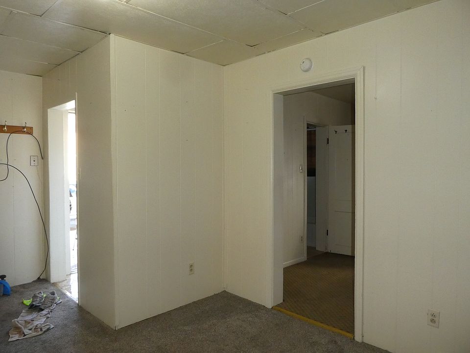 Living room with doors to kitchen and bedroom
