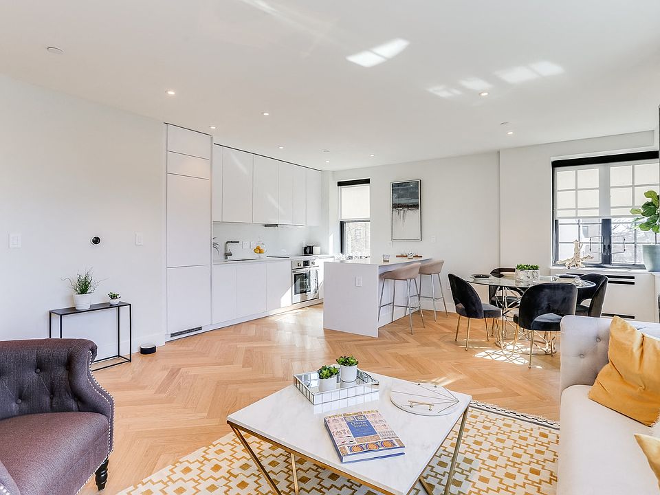 Open concept living and dining rooms with brand new hardwood flooring