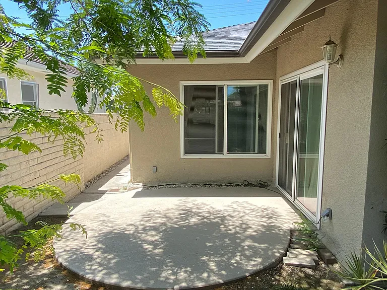 Patio outside 2 bedrooms.