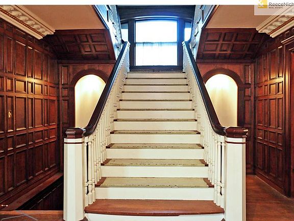 Grand staircase that continues to the third floor.