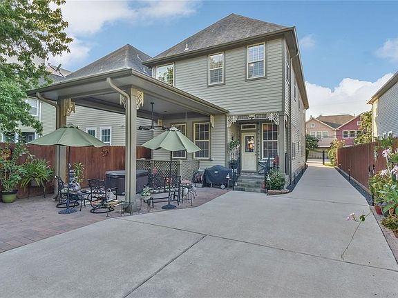 Current owner created a beautiful backyard oasis featuring pergola addition, brick pavers and hot tub.