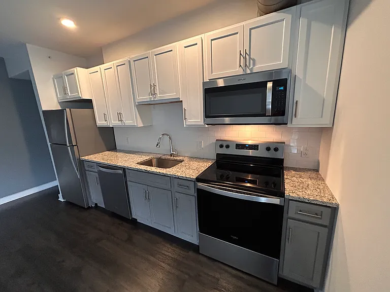 Kitchen w/ Soft Close Drawers and Cabs, Granite Counters, Subway Tile Back Splash, WhirlPool Appiances.