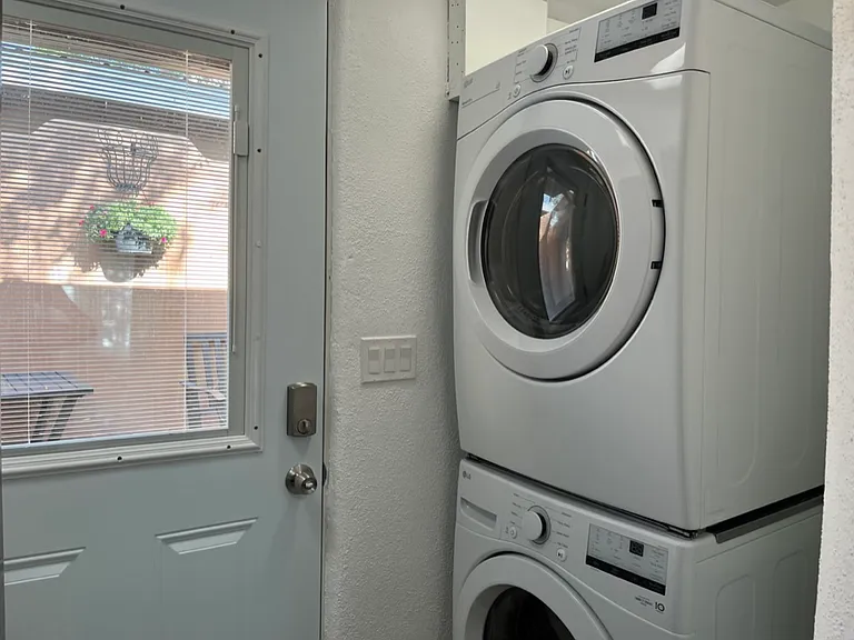 Laundry is a shared space , however it has two different access doors for each unit.