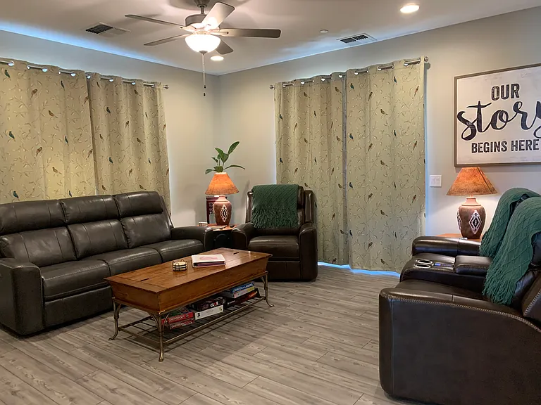 All leather reclining sofa, Loveseat and chair with adjustable lumbar and headrests.