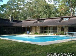 Private park-like back yard with Olympic-sized in-ground pool