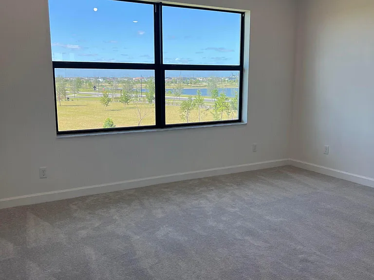 PRIMARY SUITE OVERLOOKING MILE LONG LAKE AND NEW CLUBHOUSE AREA WALKING DISTANCE TO NEW POOL