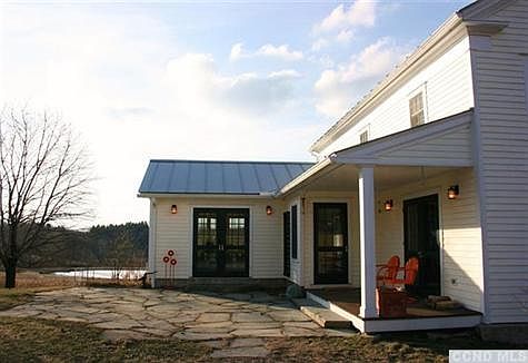 Stone Patio, Covered Back Porch with Doors to Great Room, Living Room and Mudroom.