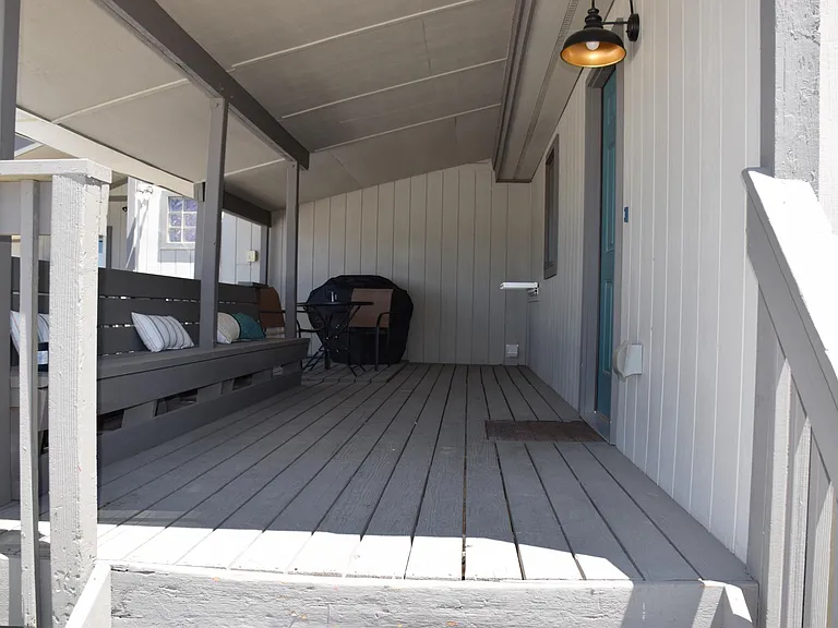 Entrance and deck. Locking ski rack, bbq and railing to lock up bikes.