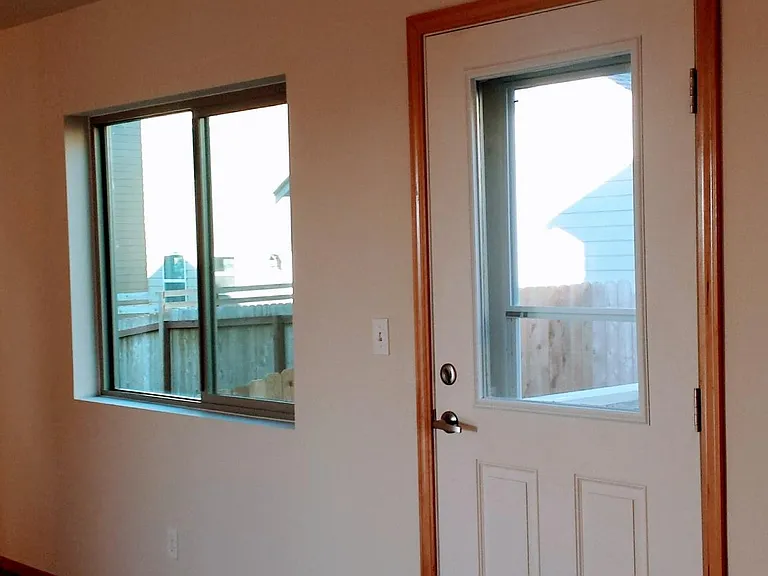 Back door to fenced back yard and patio.