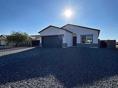 2 car garage with paver driveway