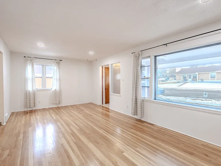 Large living room with huge picture window.
