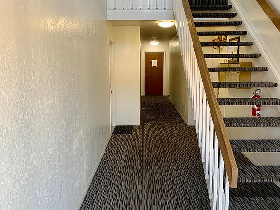 Hallway of building- mailboxes are under stairs- E is up the stairs on the left