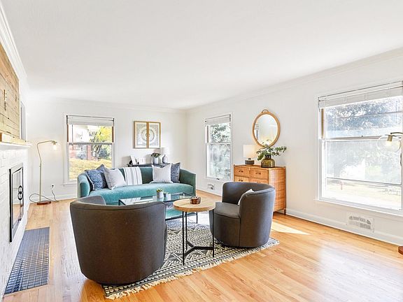 Hardwood floors were just refinished and home has just been painted throughout. New sofa, chairs, rugs, plants, and accessories.