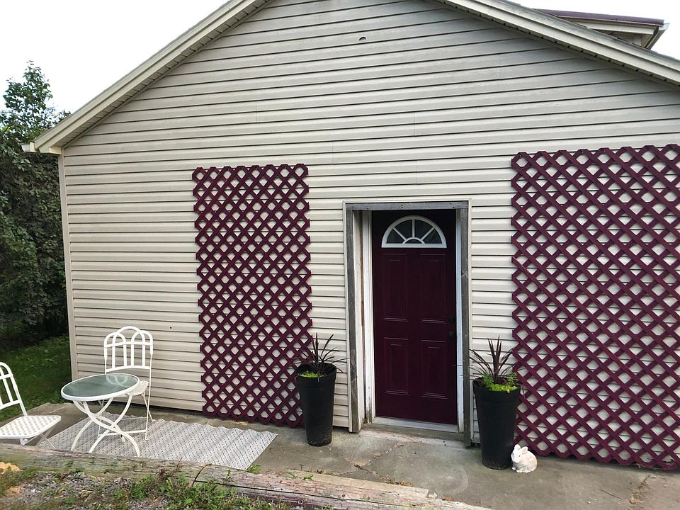 Main entry to the house is around the back of the building, away from the main street and right next to parking.