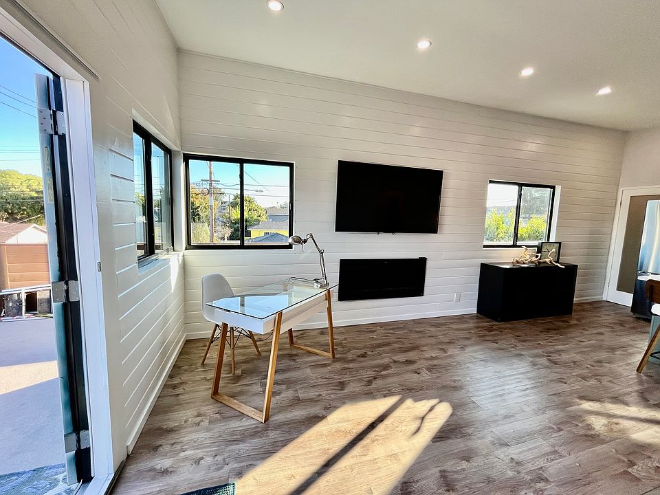 New windows on southern-facing wall, overlooking 5'-wide private balcony, both lets in tons of light and provides privacy.