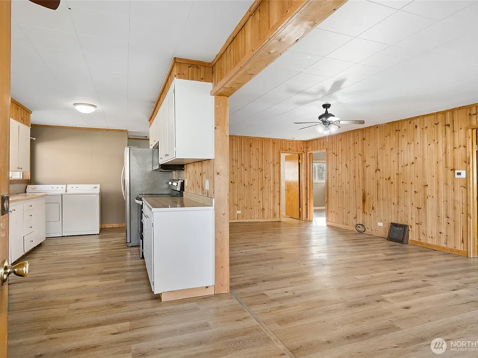 Kitchen and open living space.>