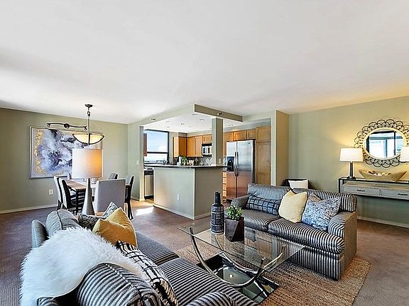 View of living, dining & kitchen area from corner of living area.