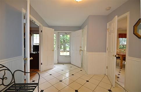 Spacious Tiled Entry Foyer: Custom Tile w/ Natural Slate Diamond Inset