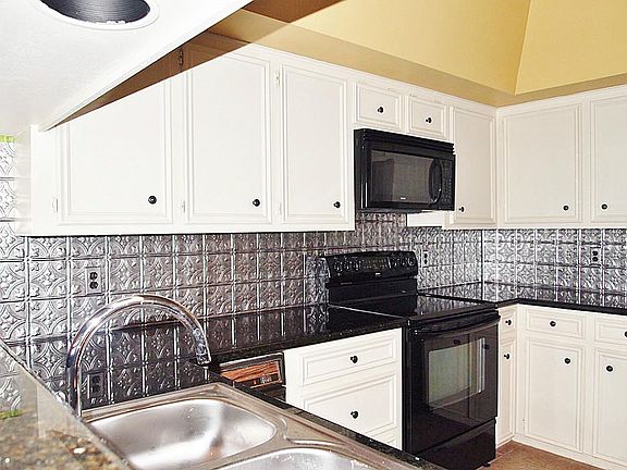 Granite countertops, trash compactor, lots of storage and room to spare for cooking and entertaining.
