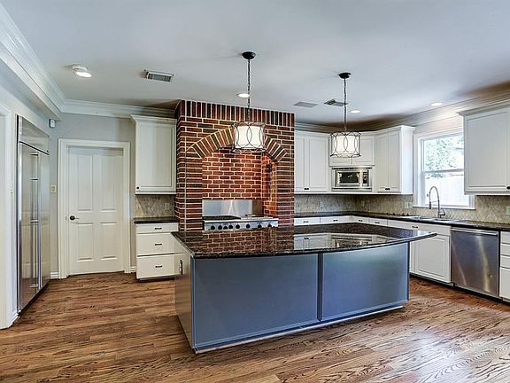 Large open concept kitchen with a island with plenty of space for several barstools.