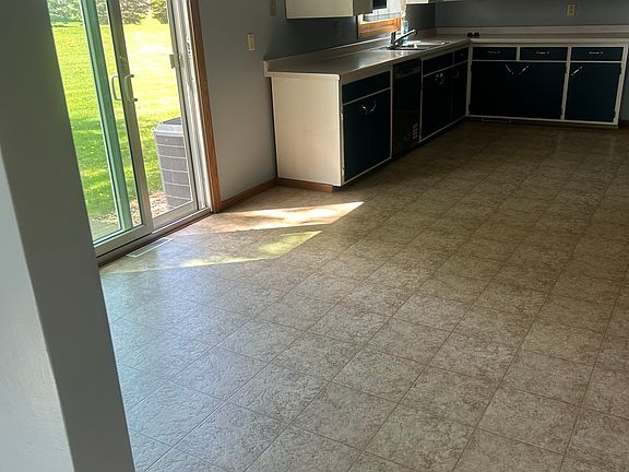 Large space for eat in kitchen with sliding glass door