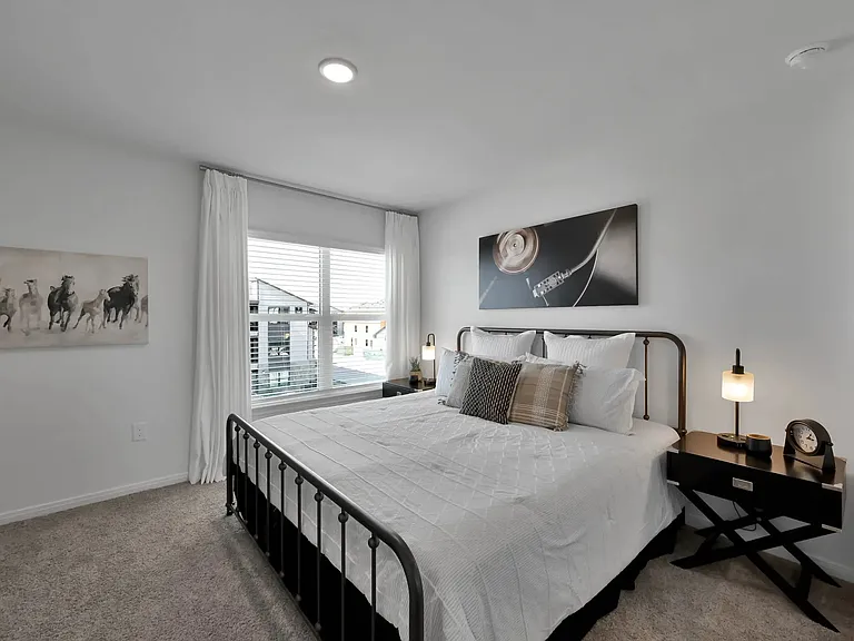 Enjoy luxury living at Esperanza at Wild Orchid. This beautifully designed bedroom features modern decor, abundant natural light, and a cozy atmosphere. Elevate your lifestyle and schedule a tour today to see your new home!