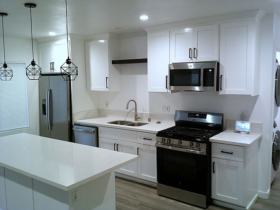 Open Kitchen Space with large island and counter (white marble)