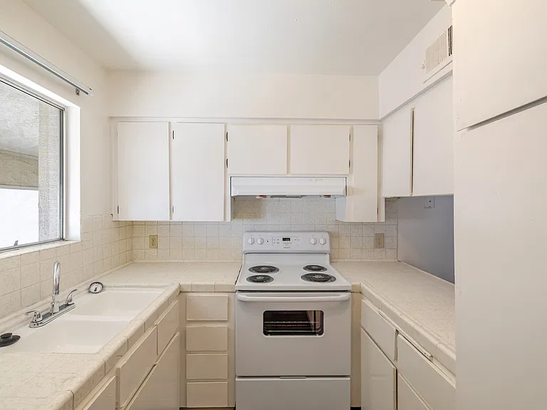 Bright Kitchen with Ample Cabinet Space.