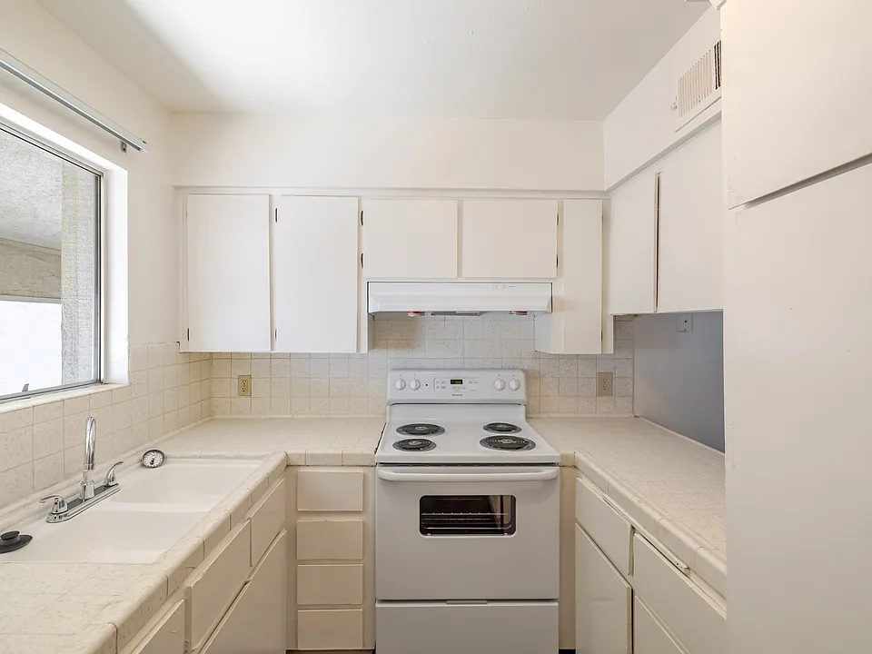 Bright Kitchen with Ample Cabinet Space.