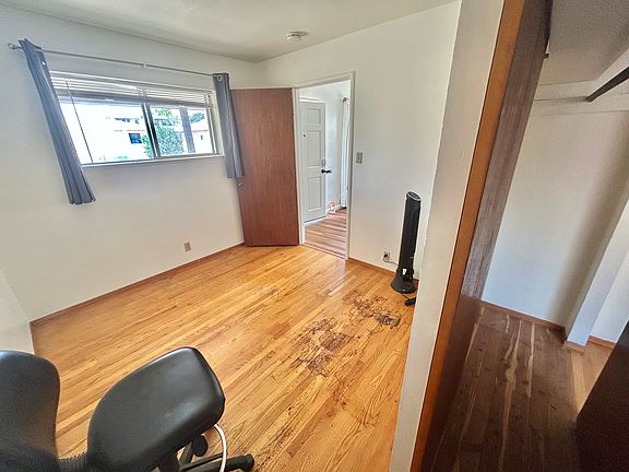 1st bedroom, showcasing unique closet design.