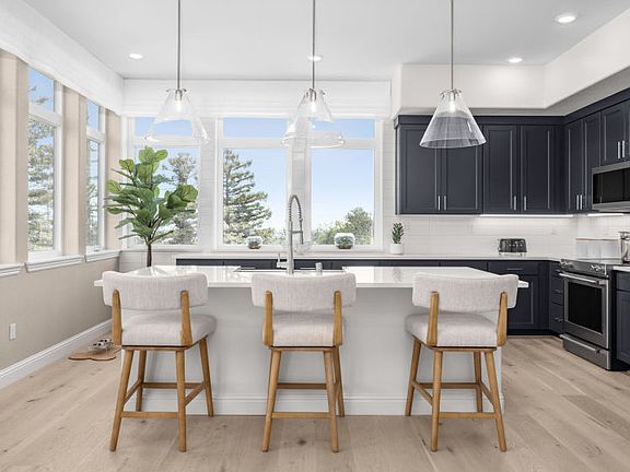 Kitchen with large windows and natural sunlight