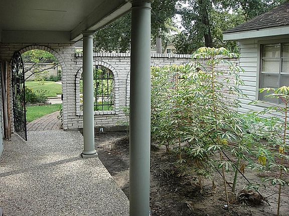Home has courtyard with gated entry.