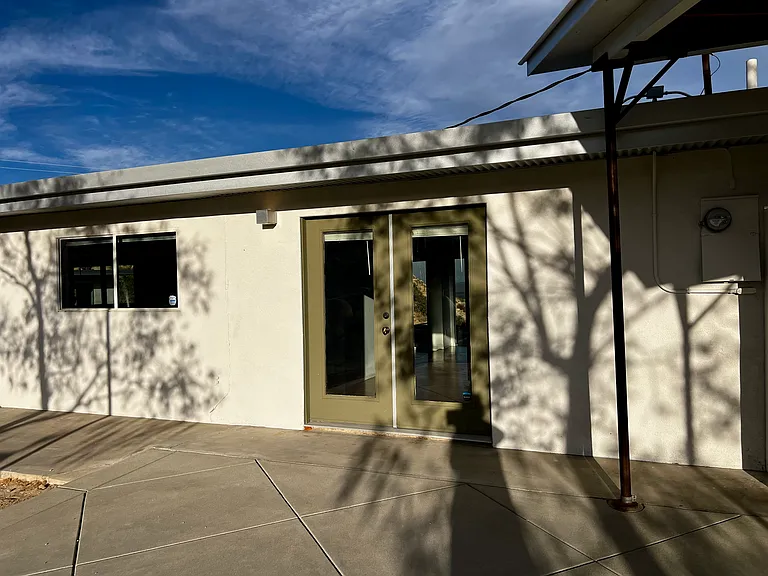 French doors leading into kitchen from back patio