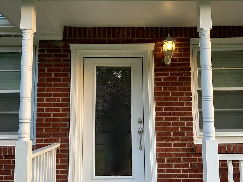 Front Entry with new rain drop obscure insulated glass door.