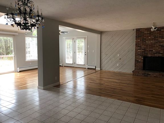 Expansive family room seamlessly connects to the kitchen for versatile living and entertaining.