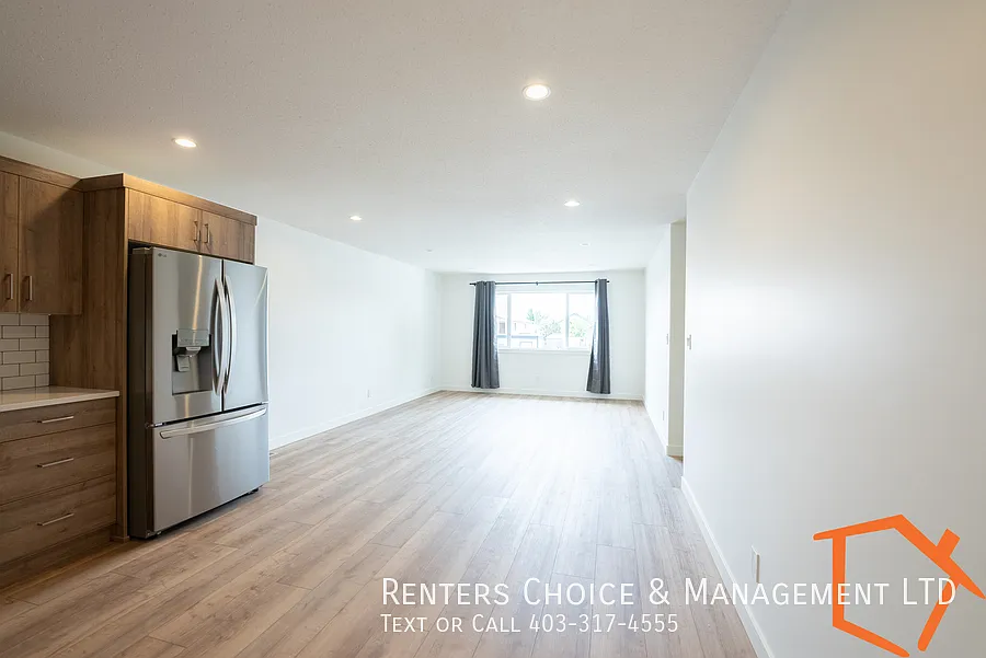New 2 Bedroom Main Floor Unit With Assigned Parking — Photo 3
