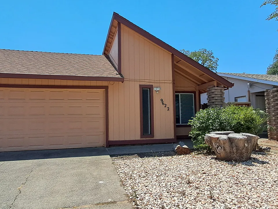 Entrance door/two car garage and drive way.