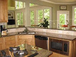 spacious, open kitchen w/ granite andstainless steel appliances