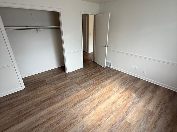 Bedroom #1 with fresh paint and brand new flooring.