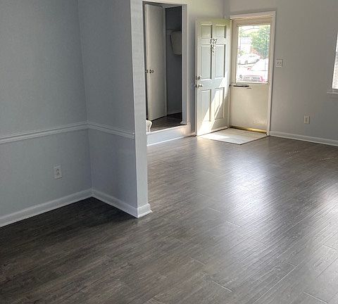 Front entry and den open to dining room