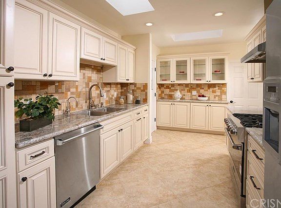 The familys chef is going to truly appreciate the gourmet kitchens new LED recessed lighting, abunda