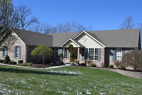 Beautiful ranch with mature trees and side entry 3 car garage.