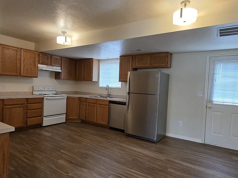 KItchen, Dining Area, and Door to Back Yard